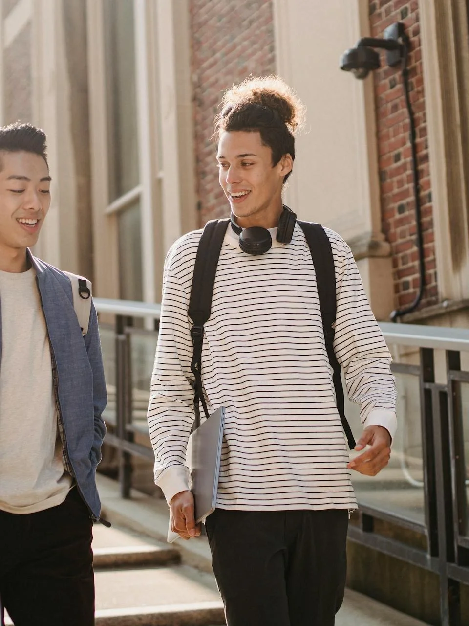 Multiracial classmates walking together on campus