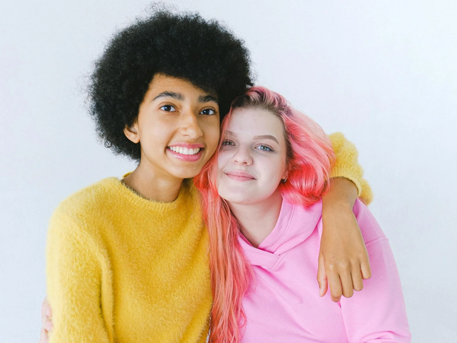 Happy multiethnic teen friends smiling together