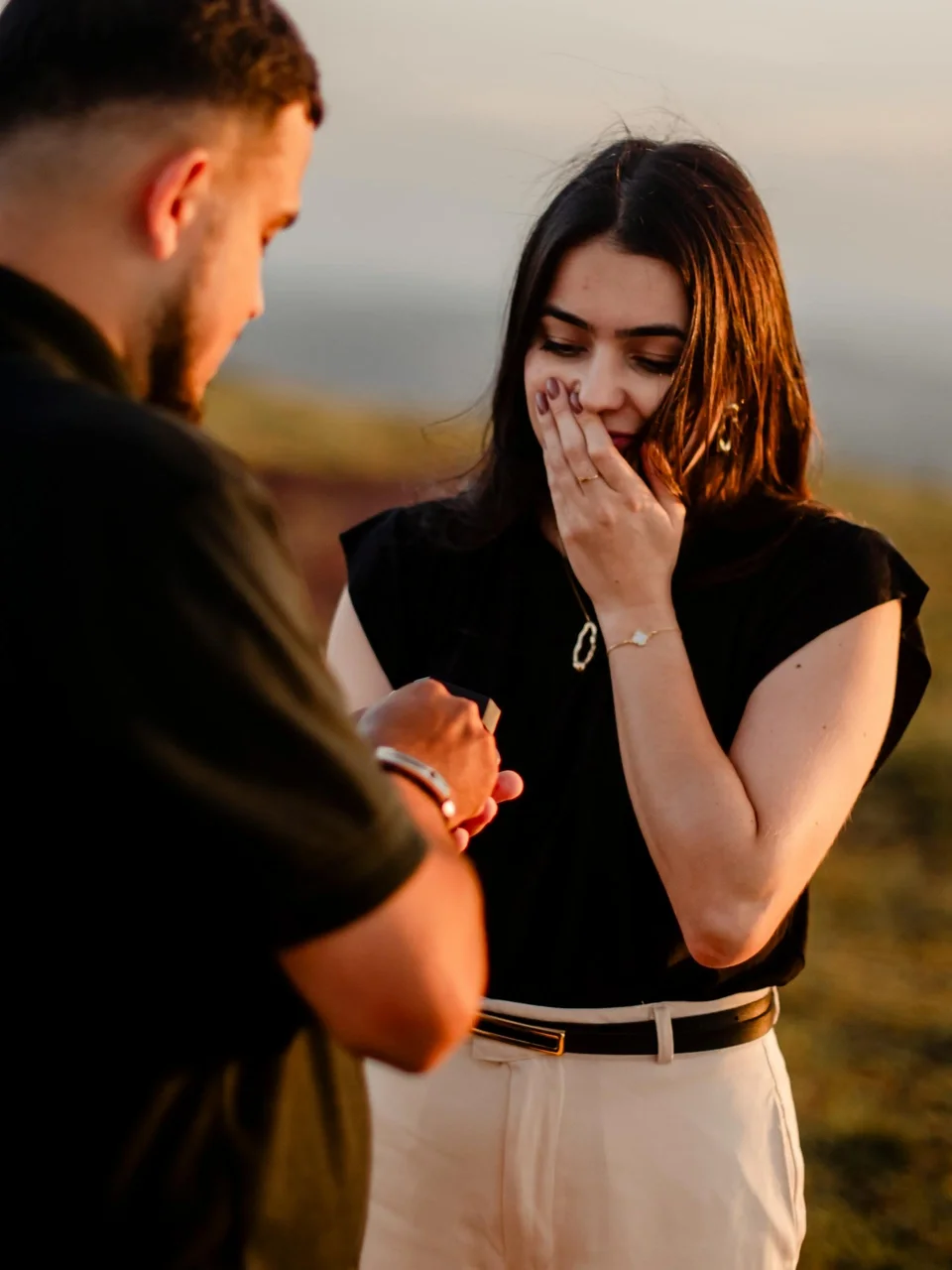 Romantic marriage proposal at sunset outdoors