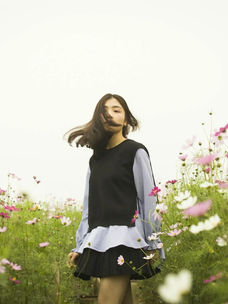 Woman in a vibrant flower field, embracing nature
